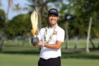 Kevin Na Holding Trophy In Hawaii