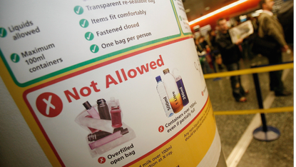 A sign outlining airport security requirements for carrying liquids through security