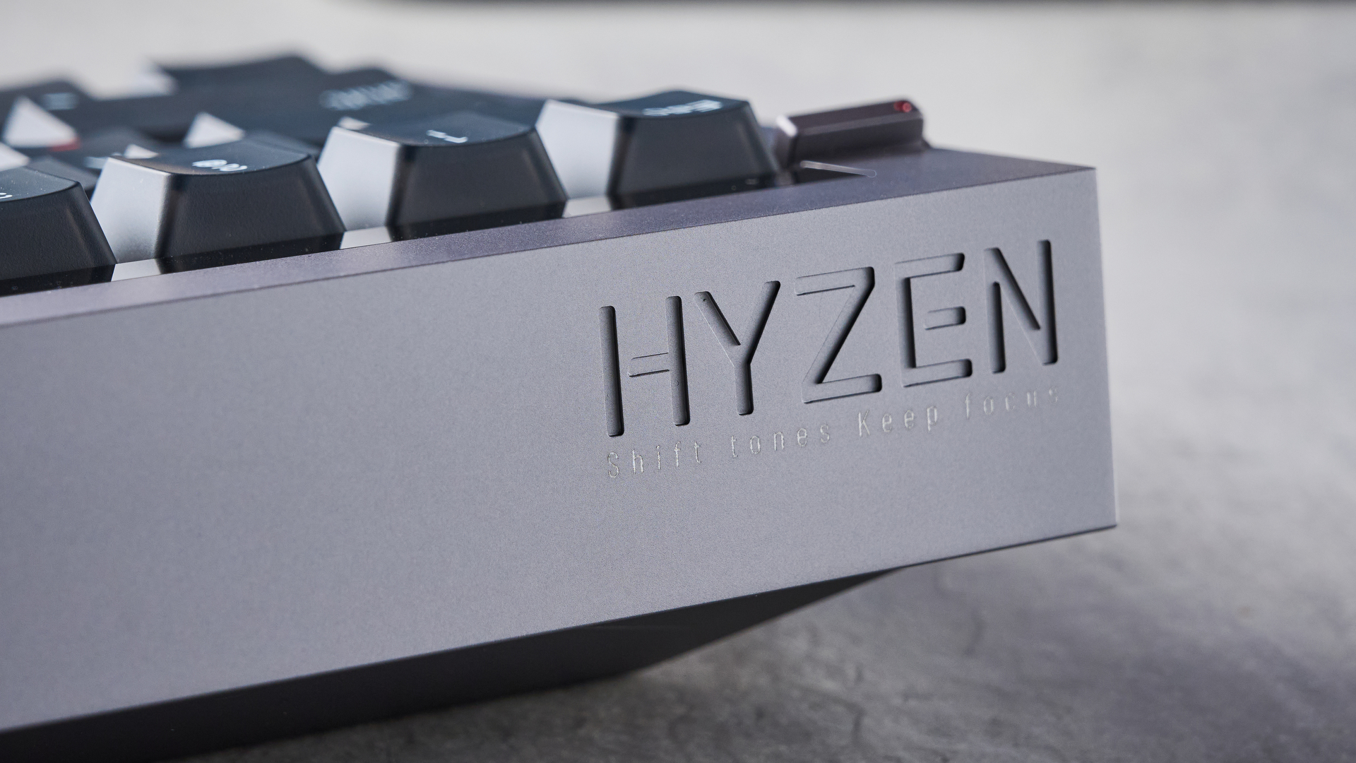 The Lofree Hyzen keyboard on a stone surface