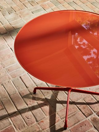 Eames round table by Herman Miller and Hay outdoors