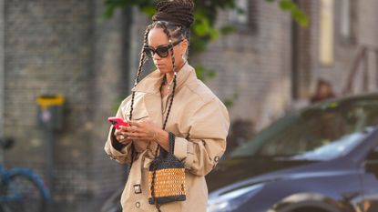 amazon prime big deal days editors picks - woman looking down at her phone - getty images 1611727789