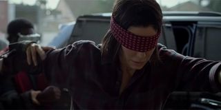 Sandra Bullock walking blindfolded in Bird Box