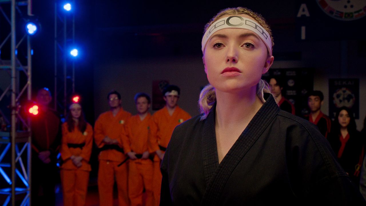 peyton list in a headband and karate uniform in cobra kai season 6 part 2