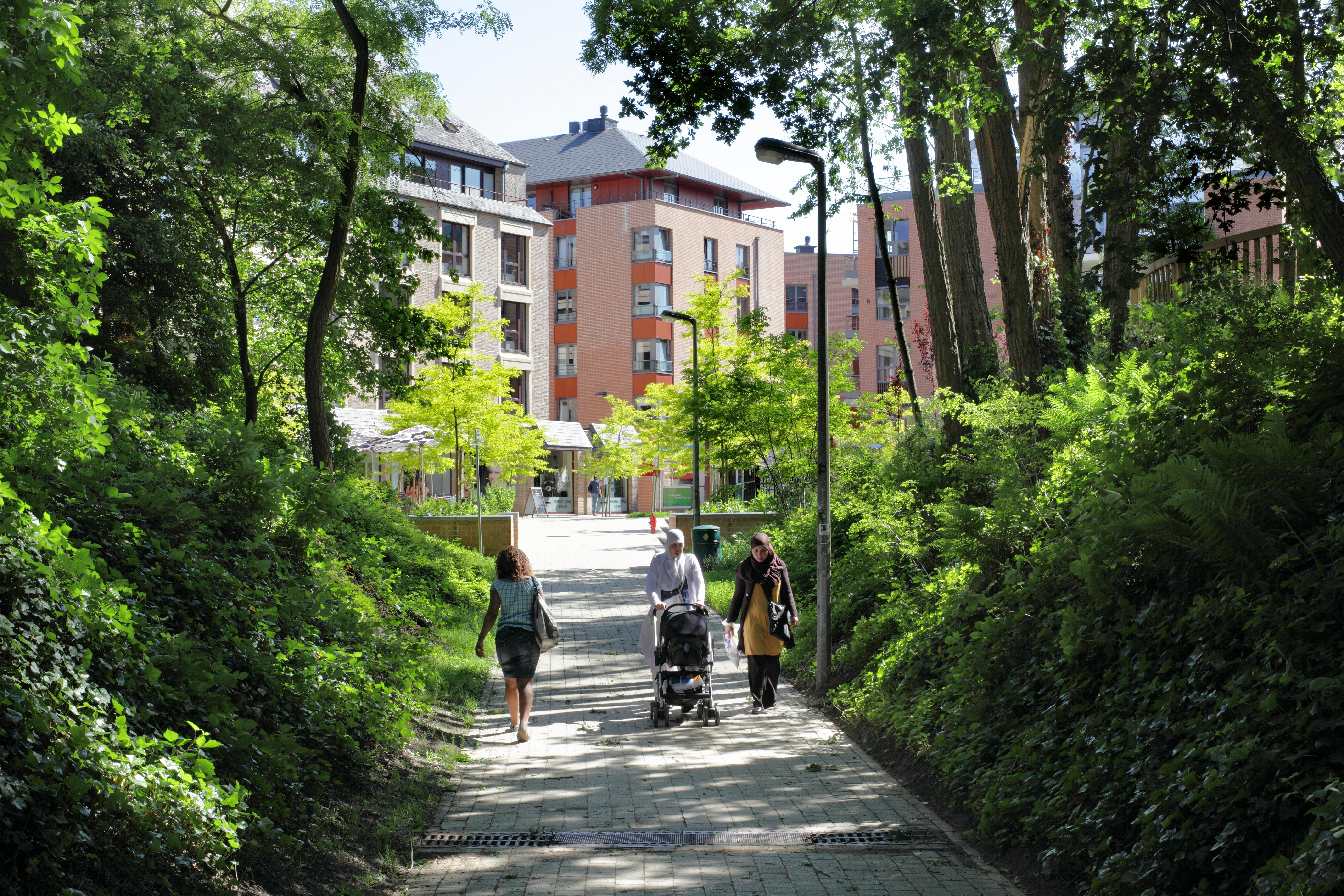 A pedestrian and cycle route into the centre of Louvain-la-Neuve, a Belgian new town with a traffic-free town centre.