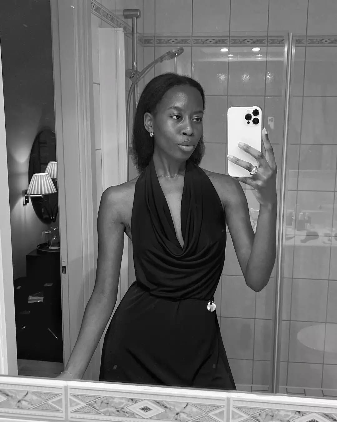Influencer wears a cowl neck top.