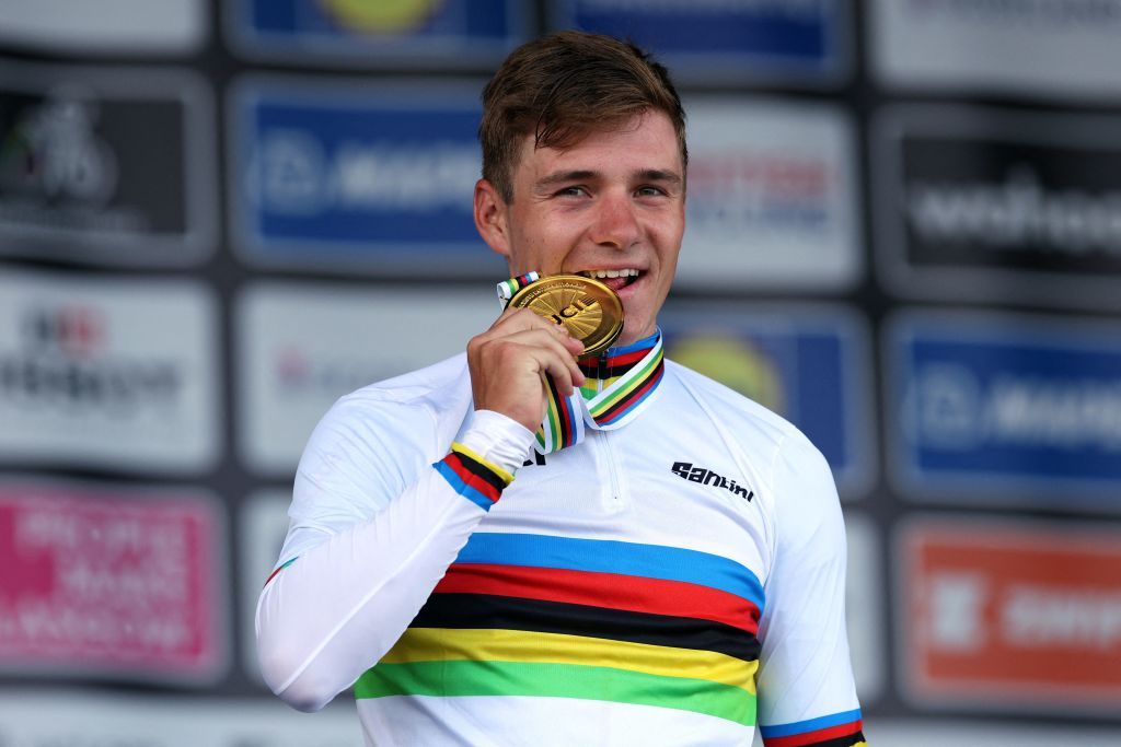 Belgiums Remco Evenepoel celebrates winning the mens Individual Time Trial in Stirling during the UCI Cycling World Championships in Scotland on August 11 2023 Photo by Adrian DENNIS AFP Photo by ADRIAN DENNISAFP via Getty Images
