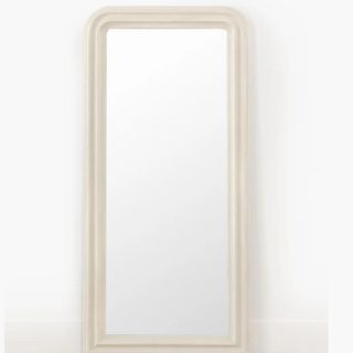 A tall curved floor mirror from McGee & Co.