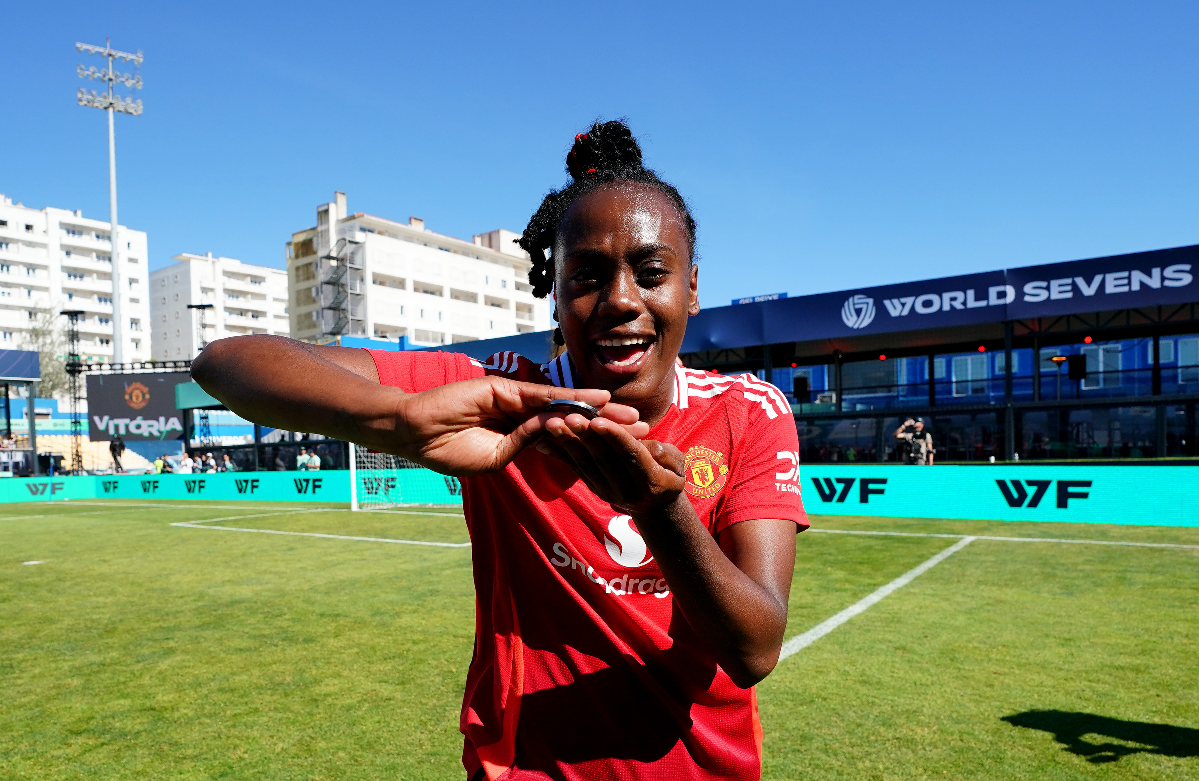 Melvine Malard Manchester United celebrates victory with her medal following the World Sevens Football Semi Final match against Man City Estadio Antonio Coimbra da Mota - May 23, 2025 in Portugal