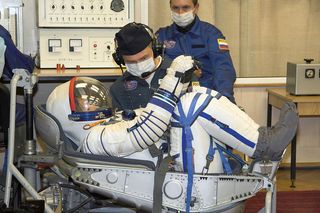 A Sokol space suit-up.