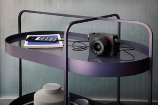 Leica Q3 on side table connected to phone