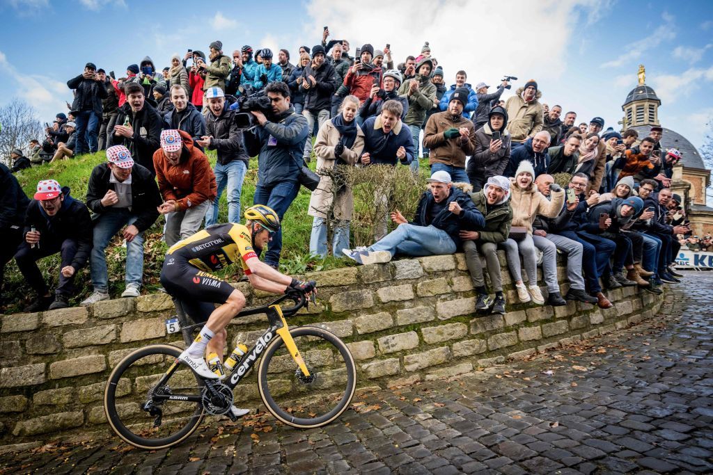 Dylan Van Baarle (Jumbo-Visma) heads off solo on Muur van Geraardsbergen on his way to victory at Omloop Het Nieuwsblad 2023