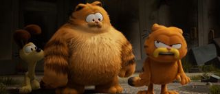 Vic (Samuel L. Jackson), Odie (Harvey Guillén) and Garfield (Chris Pratt) stand together in The Garfield Movie