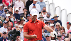 Rory McIlroy looks down at the tee box
