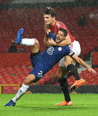 Harry Maguire tussles with Cesar Azpilicueta