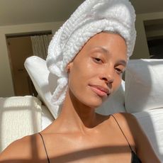 A selfie of Tylynn with a white towel on her head