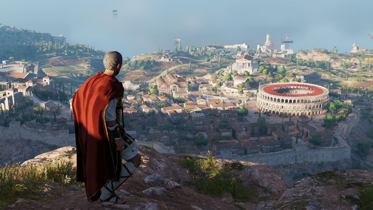 Standing above a city in AC Origins Discovery Tour
