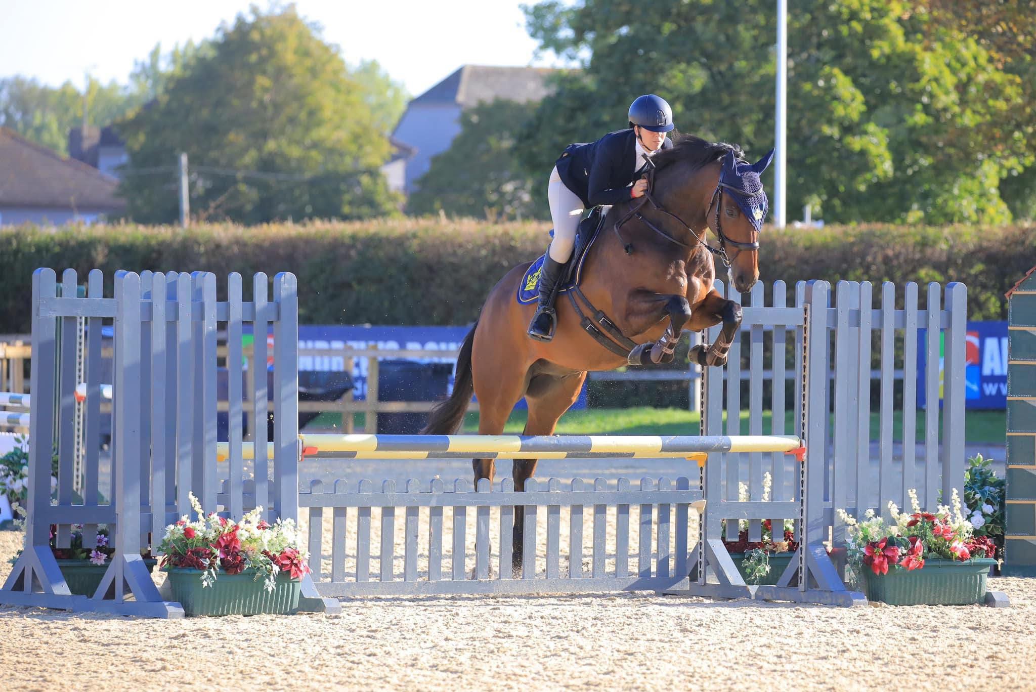 Hannah Bishop and retrained racehorse Annacotty in showjumping action at Hickstead