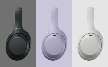 Sony WH-1000XM4C headphones in lavender, black and 'platinum silver', with backgrounds in the same color