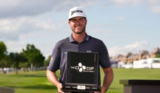 taylor pendrith holds a trophy