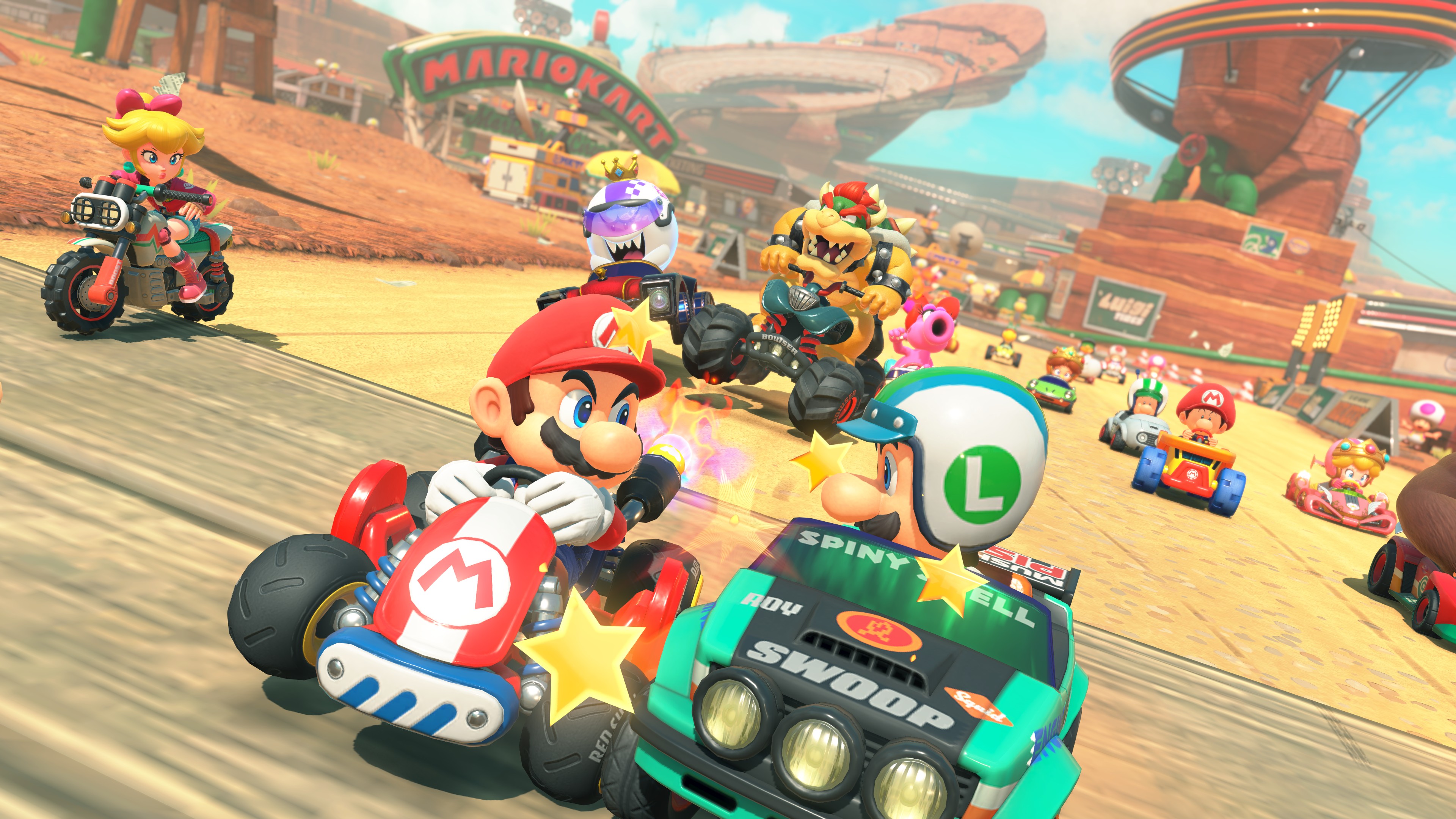 Screenshot from Nintendo Switch 2 title Mario Kart World, showing Mario and Luigi bumping karts at the front of the pack on a racetrack