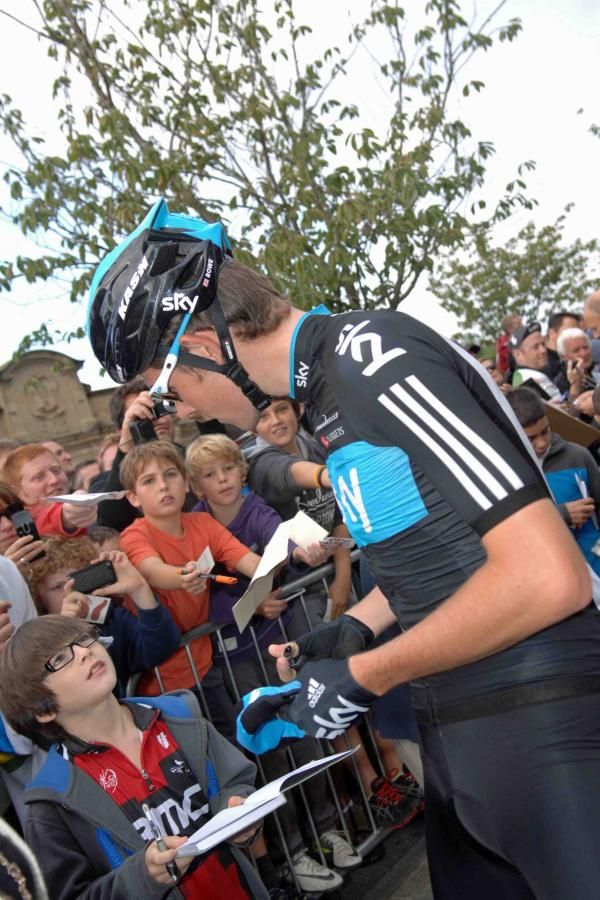 Luke Rowe signs autographs for a young fan