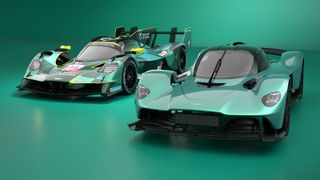 The Aston Martin Valkyrie Hypercar alongside the road-going Valkyrie