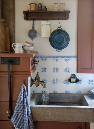 reclaimed stone sink in rustic kitchen