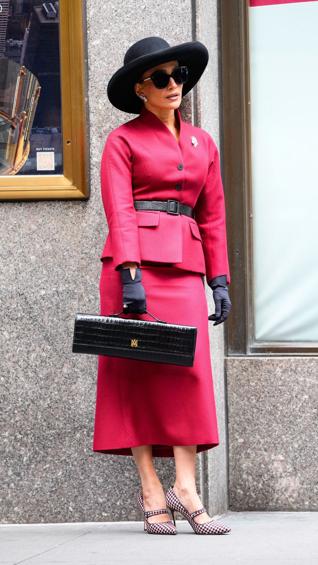 Jennifer Lopez wearing red skirt suit in New York on 10 October, 2025