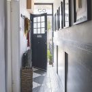 hallway with grey floor and white wall