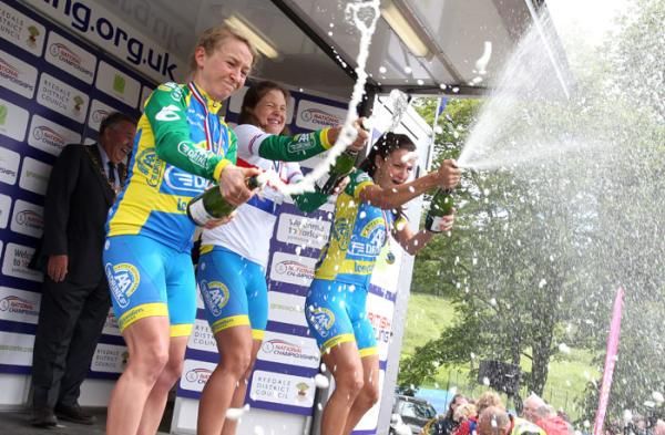 Celebration time as AA Drink leontien.nl teammates Emma Pooley, Sharon Laws and Lizzie Armitstead spray the champagne