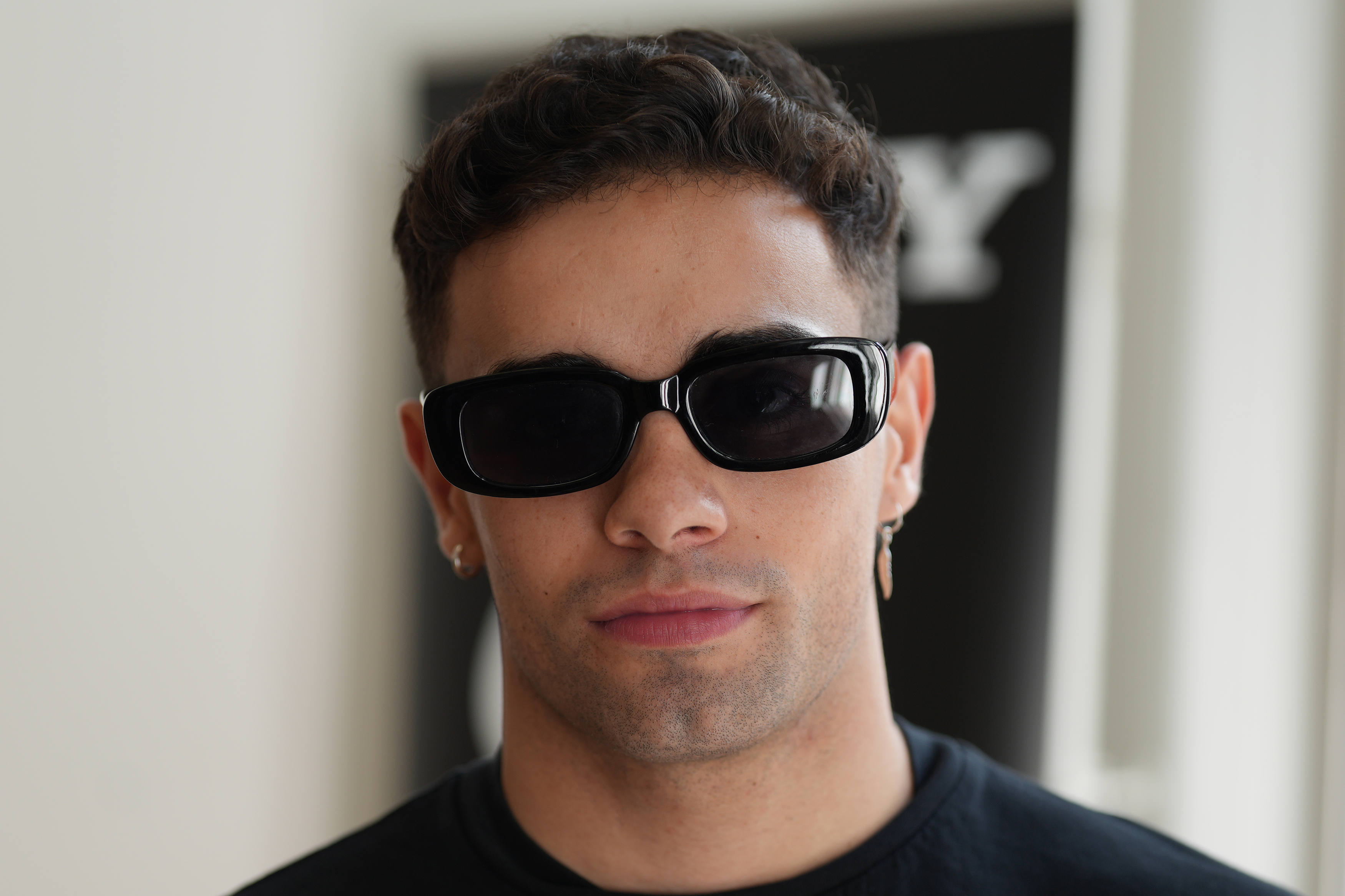 A man wearing dark sunglasses