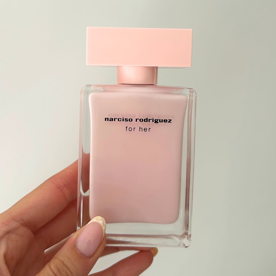 Hand holding bottle of Narciso Rodriguez For Her Eau de Parfum 50ml