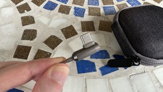 SoundMagic E80D wired USB-C hedaphones on grass and mosaic