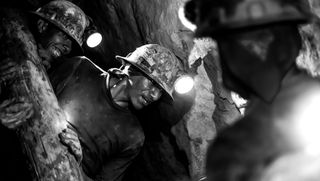 Miners down the Cerro de Rico mine