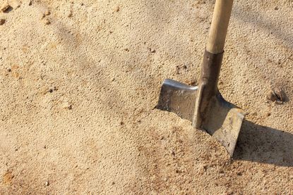 Shovel In Sandy Soil