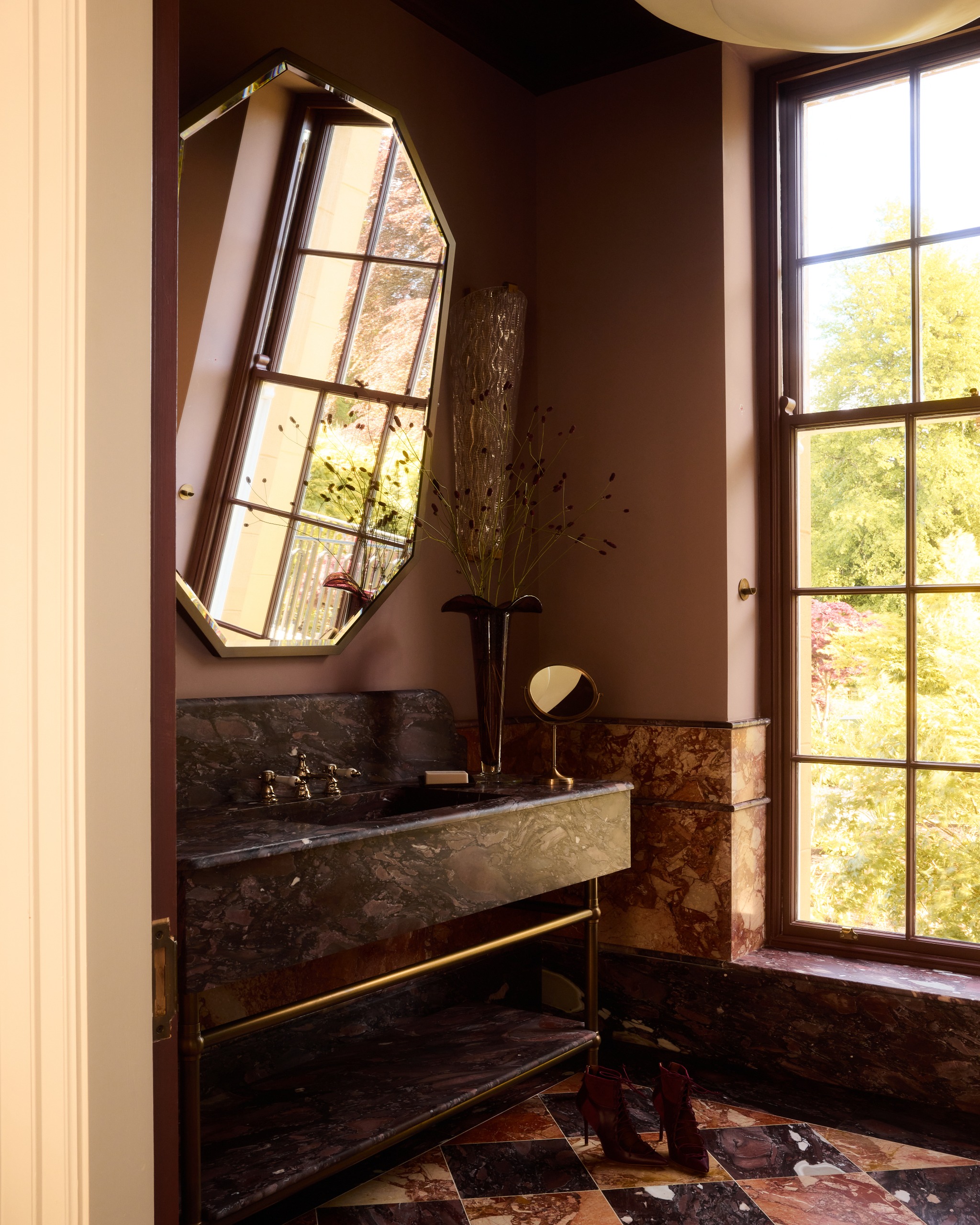 a bathroom in neutral colours with stone finishes that are very similar, but not quite the same.