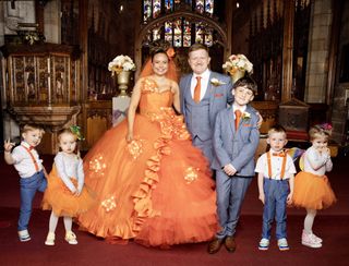 Gemma Winter in her huge orange wedding dress at the church with Chesney Brown and their children