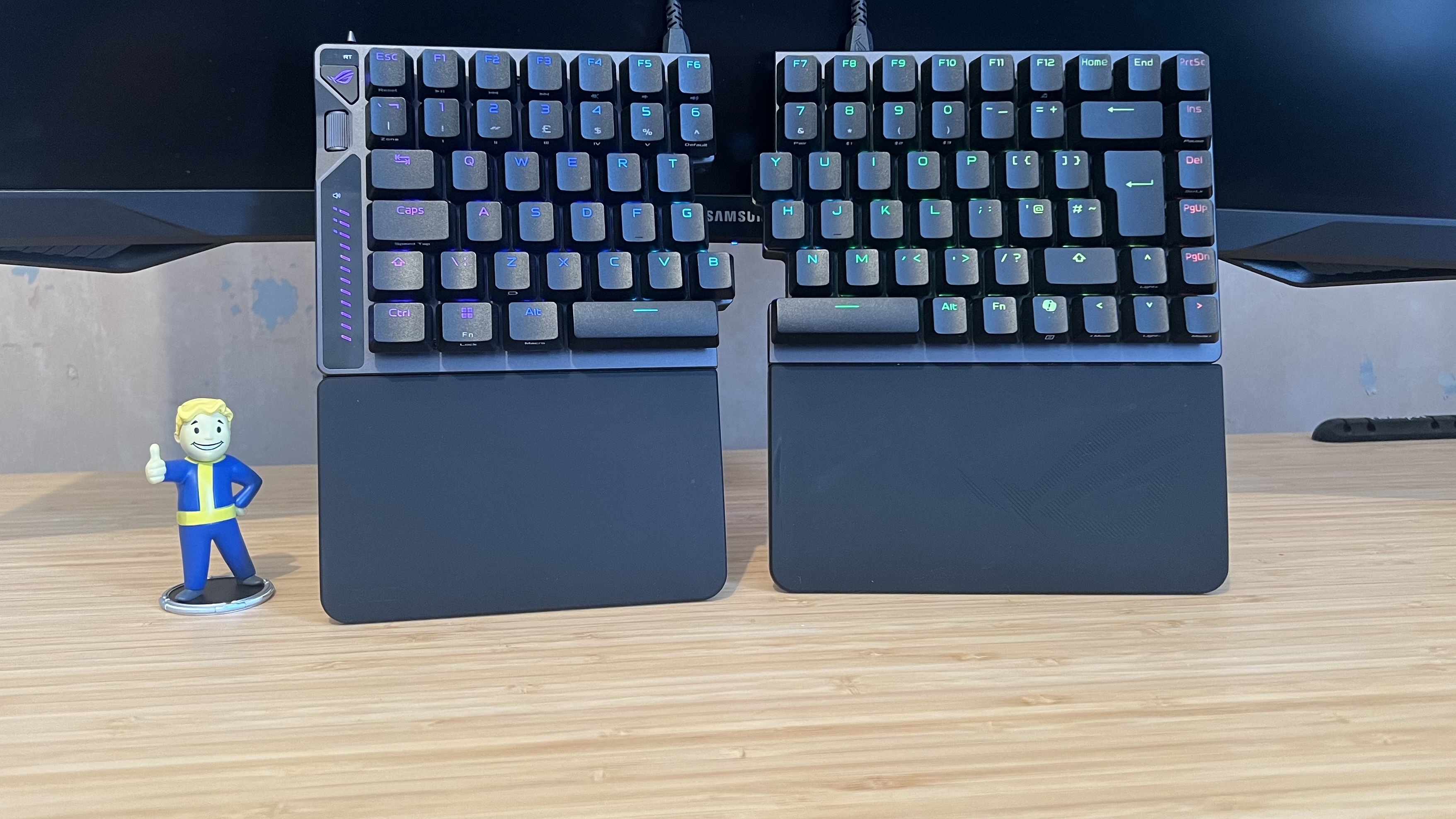 Asus ROG Falcata gaming keyboard on a wooden desk 