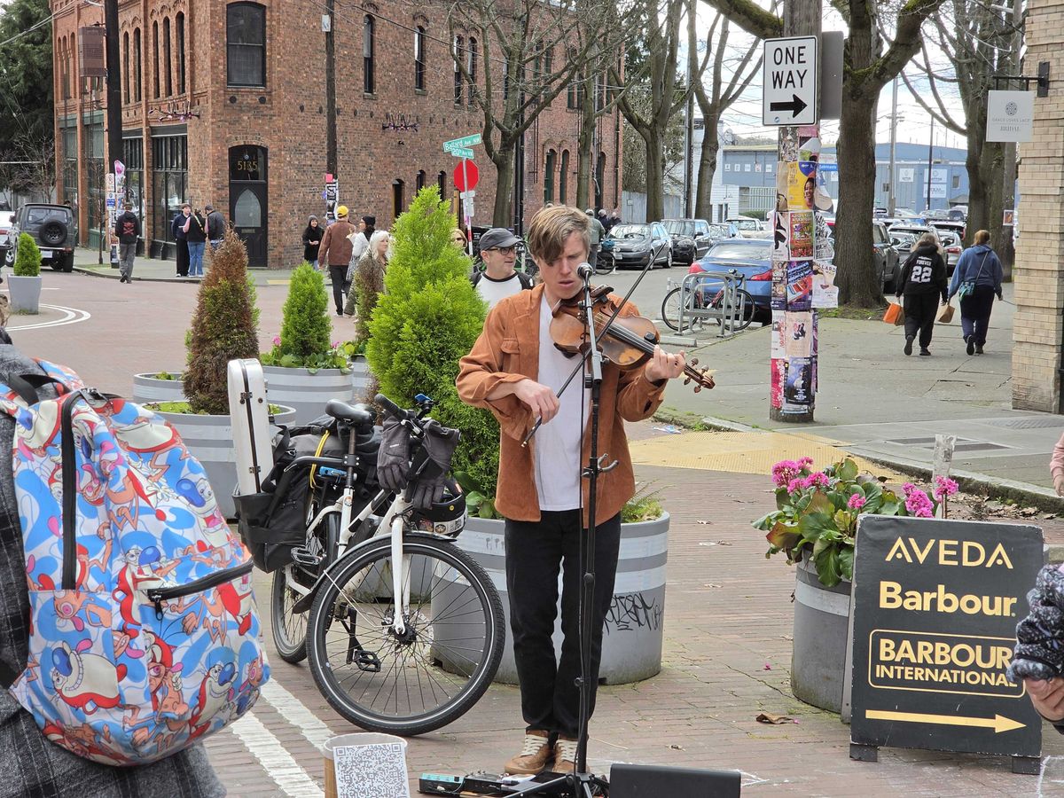 A man playing a violin (3x)