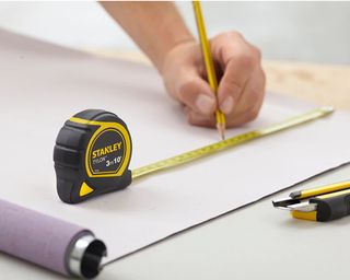 stanley tape measure on a piece of paper - stanley