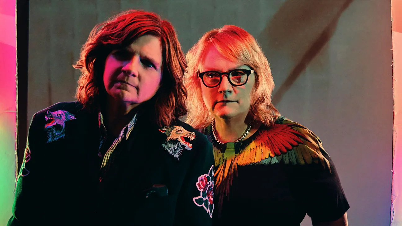 Amy Ray and Emily Saliers in an image from the indigo girls doumentary it's only life after all with bright colors treated over the image