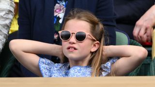 Princess Charlotte of Wales watches Carlos Alcaraz vs Novak Djokovic in the Wimbledon 2023 men's final on Centre Court during day fourteen of the Wimbledon Tennis Championships at All England Lawn Tennis and Croquet Club on July 16, 2023 in London, England