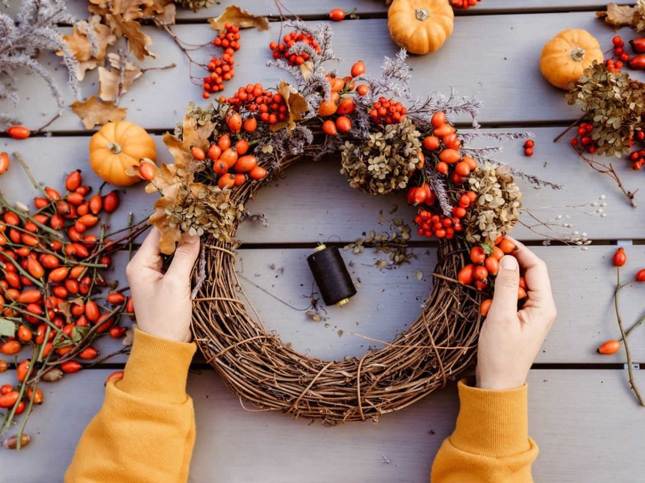 Person Making A Fall DIY Honeysuckle Wreath