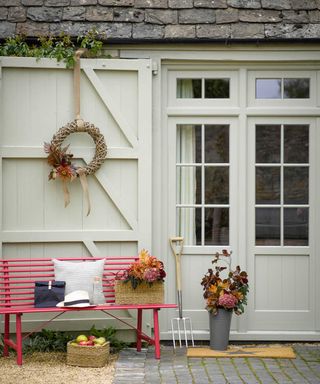 front porch with bench from garden trading and autumn wreath
