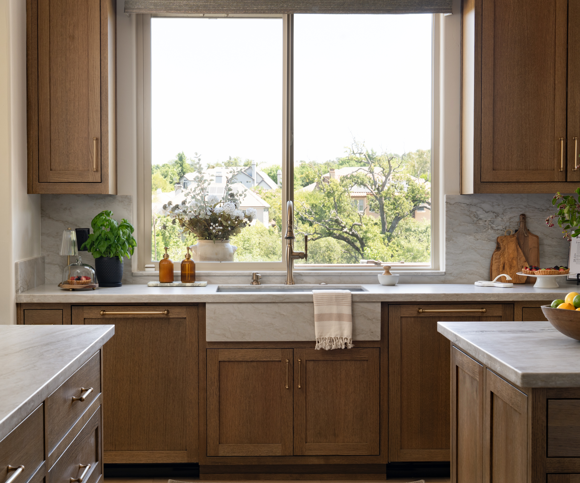 wood kitchen with stone sink under window