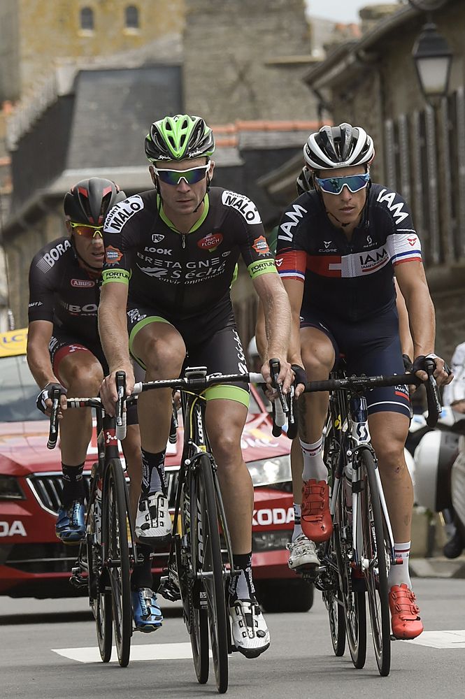 Poland's Bartosz Huzarski, France's Pierre-Luc Perichon, France's Sylvain Chavanel ride in a breakaway during the 181.5 km eighth stage