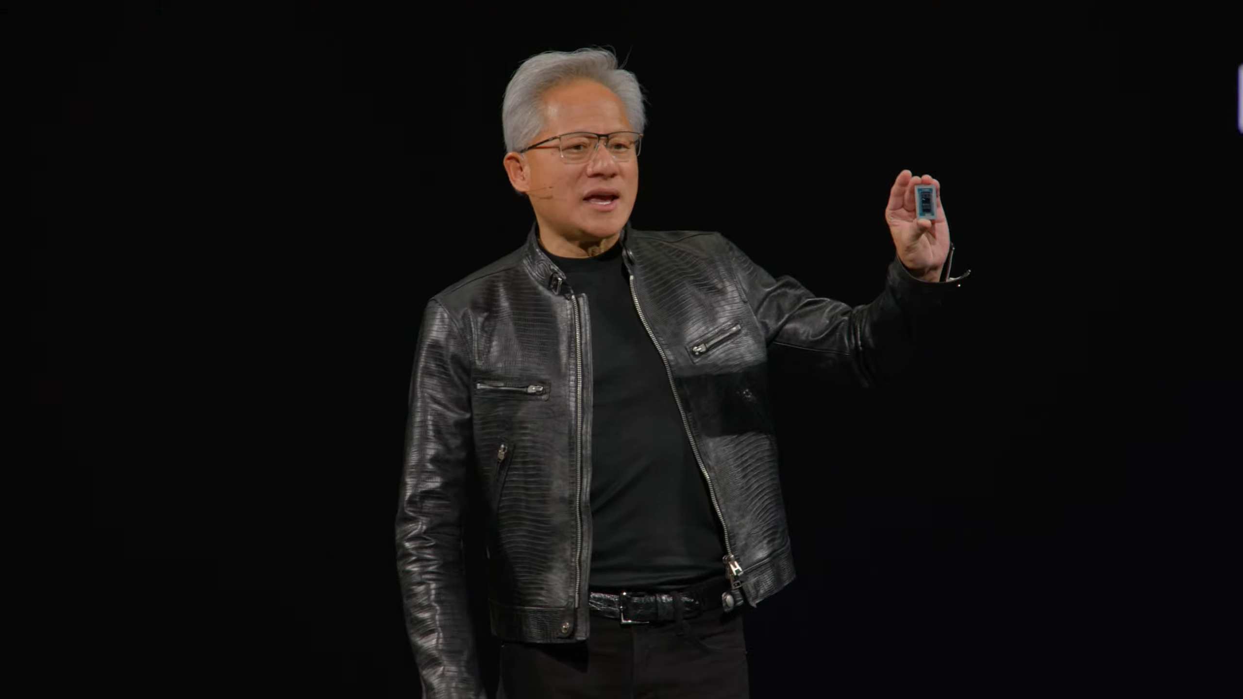 Jensen Huang with RTX Spark chipset in hand