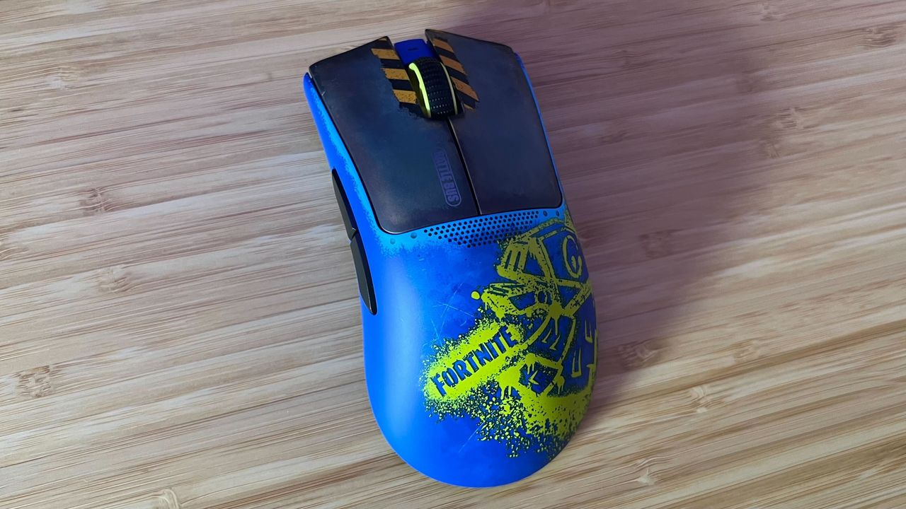 Razer DeathAdder V3 Pro Fortnite Edition gaming mouse on a wooden desk