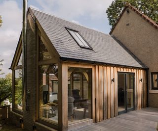 single storey pitched roof oak extension to side of property