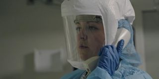 A doctor in protective gear in Totally Under Control